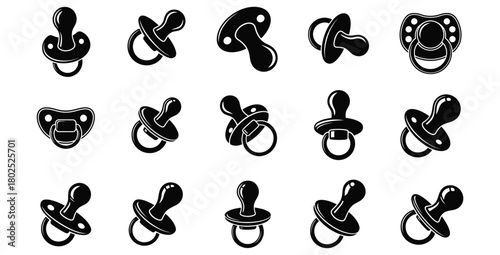 Collection of black and white baby pacifiers in various shapes and design variations