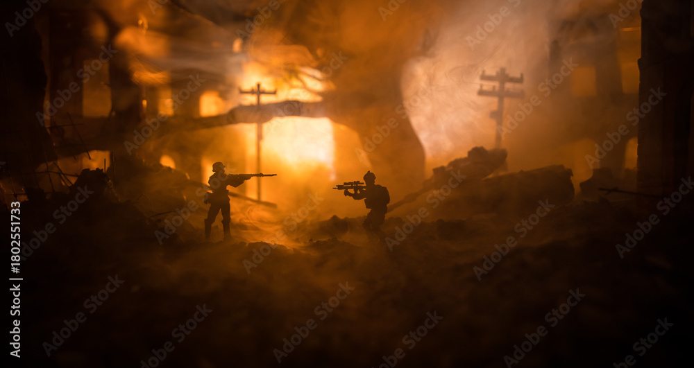 Fototapeta premium War Concept. Battle scene on war fog sky background, Fighting silhouettes Below Cloudy Skyline at night. City destroyed by war