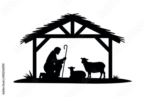 A silhouette of a shepherd kneeling in a stable with two sheep and a staff.