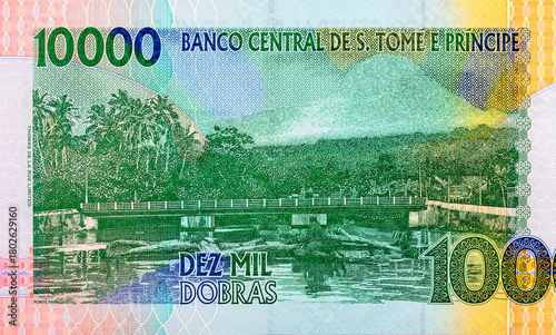 Wallpaper Mural 10000 Dobras, Sao Tome and Principe with the image of the Ponte Papagaio bridge and a river landscape. Paper money of Sao Tome and Principe Torontodigital.ca