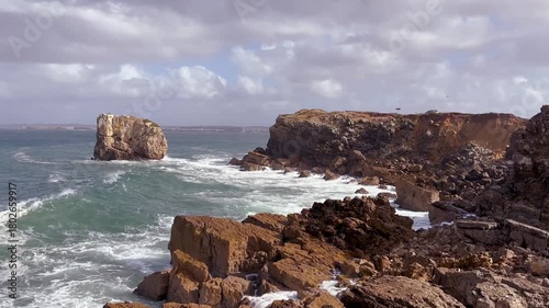 coastal waves portugal hitting the cliff