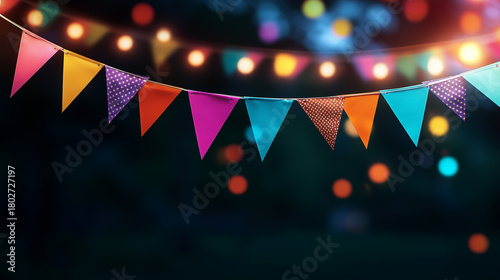 Vibrant party themed background with colorful bunting and festive string lights on dark backdrop