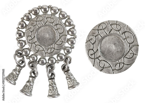 Isolated photo of vintage steel baroque metal decorative ethnic style pendants, brooch, buttons or elements on white background.
