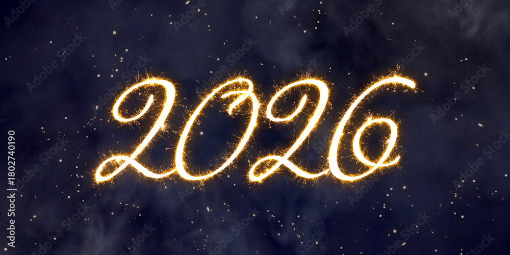 Naklejka premium 2026 depicted in brilliant gold sparkler effect against a dark smoky background with scattered shining particles