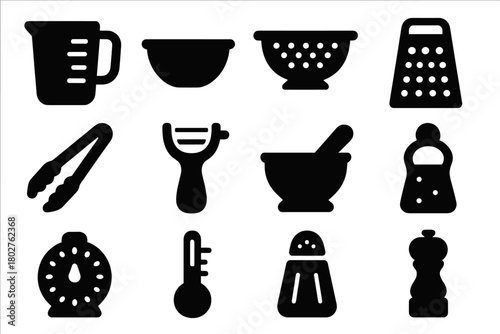 Kitchen Tools Icons. Solid style icons of Kitchen tools: measuring cup, mixing bowl, colander, grater, tongs, peeler, mortar and