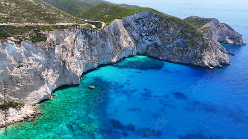 Aerial drone video of paradise scenic turquoise beaches and white rock formations near small port of Porto Vromi an ideal place to start a boat tour near amazing North Zakinthos island, Ionian, Greece