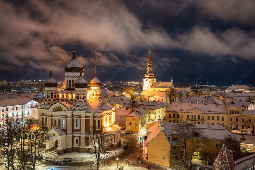 Fototapeta premium Aerial night View of Tallinn in winter with Alexander Nevsky Cathedral, roofs with snow, Christmas mood