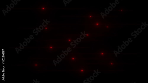 Red glowing light streaks moving horizontally across a dark black background with bokeh effects abstract