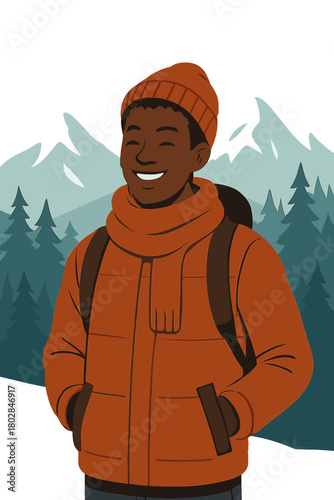 A cheerful young African man in winter clothing stands before mountains and forest