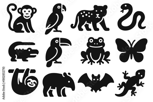 Jungle Wildlife Icons. Solid style icons of jungle wildlife: monkey, parrot, jaguar, snake, crocodile, toucan, frog, butterfly,