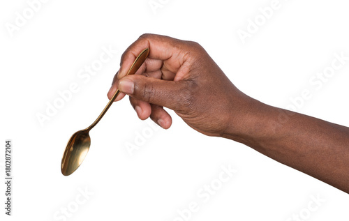 Hand holding a teaspoon isolated on white or transparent background 