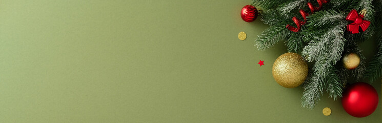 Christmas banner with fir branch, large red and gold baubles, bows, and confetti in the top right corner on a green background.