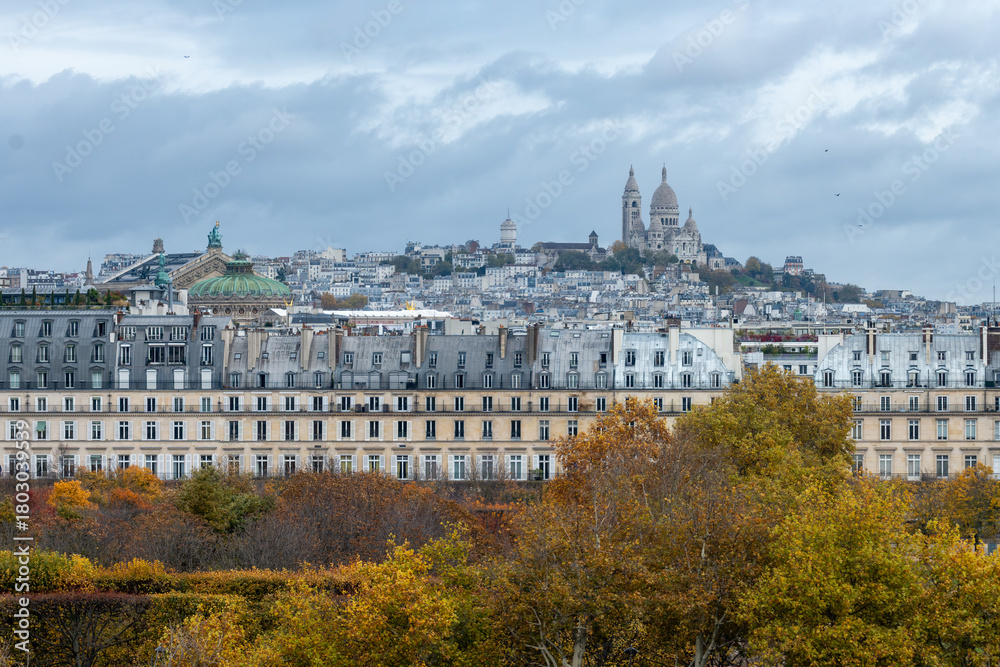 Fototapeta premium Panoramic view on Montmartre hill with church, streets, buildings, parks and museums in capital of France, central part of Paris, tourists destination, autumn days in Paris
