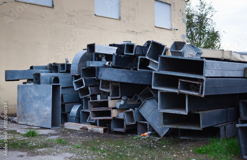 A pile of square metal pipes