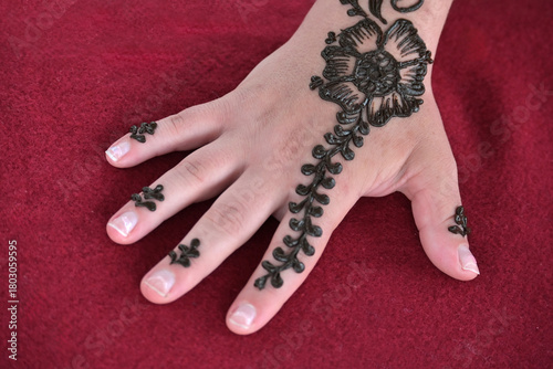 Henna design decoration on female hand