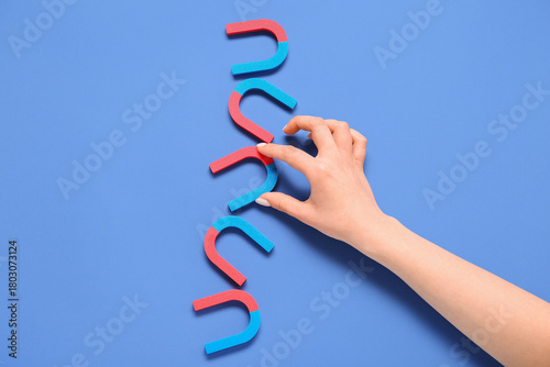 Female hand with horseshoe ...