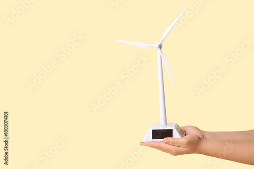 Female hands holding wind t...