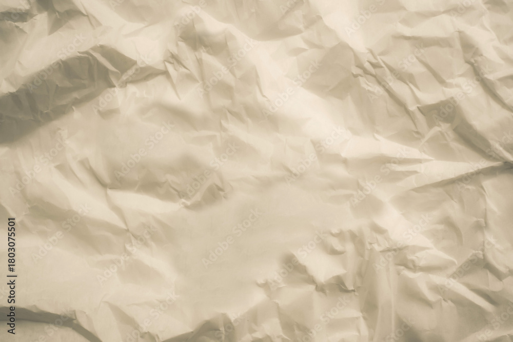 Fototapeta premium Crumpled paper texture. Background craft wrinkled paper. Neutral backdrop suitable for mockups, text overlays, and commercial use.