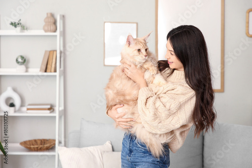 Young woman holding a fluff...