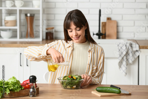 Young woman making fresh ve...