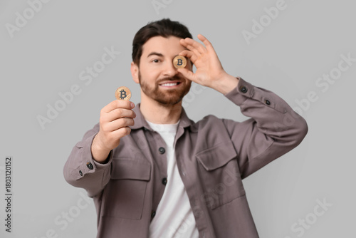 Handsome man with bitcoins ...