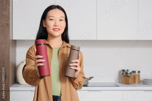 Young Asian woman with ther...