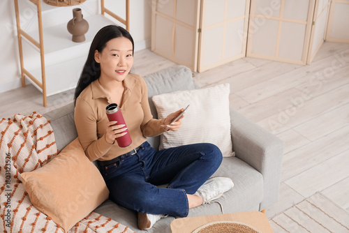 Young Asian woman with ther...