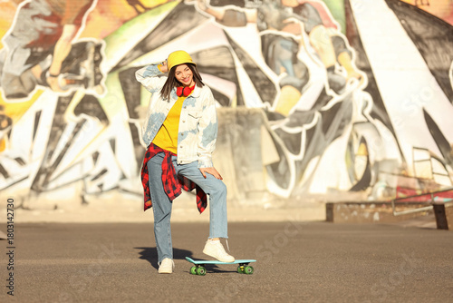 Cool young woman with skate...