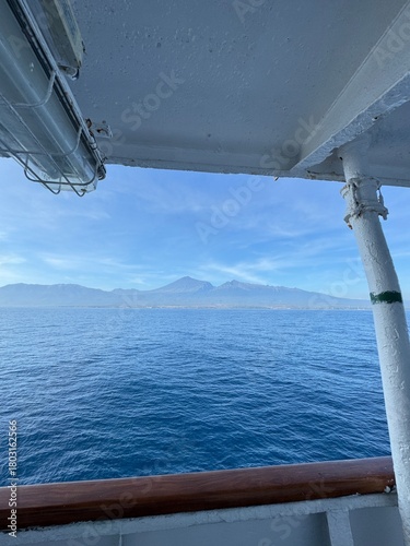 Breathtaking ocean view from a cruise ship, capturing serene blue waters and distant mountain islands for travel and relaxation concepts