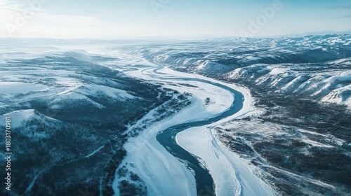 Wallpaper Mural Aerial view of a river winding through a snowy mountain landscape Torontodigital.ca