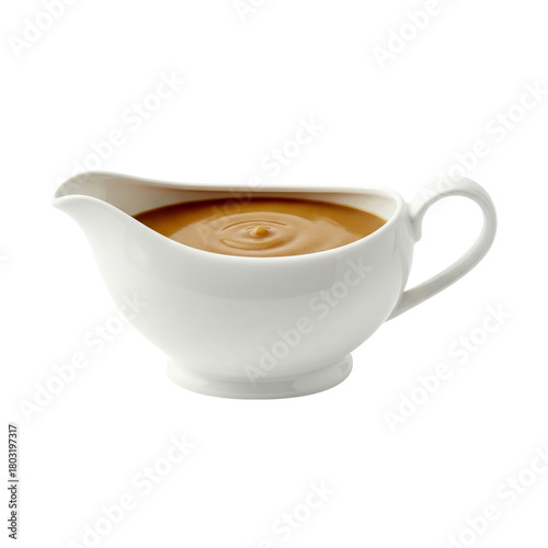 Classic white porcelain sauce boat filled with smooth, savory brown gravy.