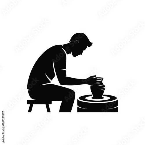 Man shaping clay on pottery wheel silhouette