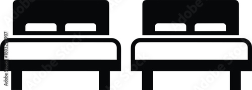 Two identical black hotel beds with white pillows and headboards on white background