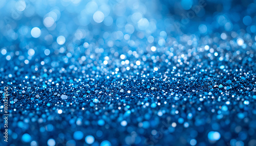 Sparkling blue glitter background with bokeh effect creating a magical and festive atmosphere 100