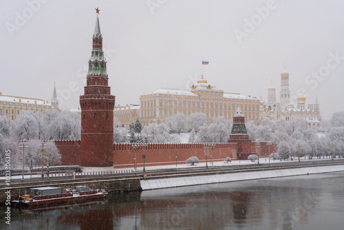 Vodovzvodnaya and Annunciation Towers of the Kremlin Wall, the Grand Kremlin Palace and the Kremlin Embankment of the Moskva River in heavy snowfall, Moscow, Russia