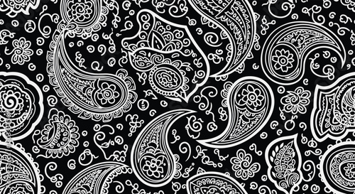 A classic and intricate black and white seamless paisley pattern, featuring elegant swirling motifs and decorative floral elements, ideal for fabric, wallpaper, or design.