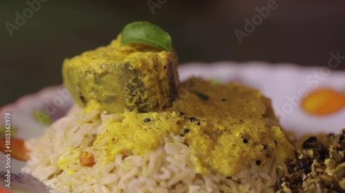 Closeup shot of serving fish curry with rice.