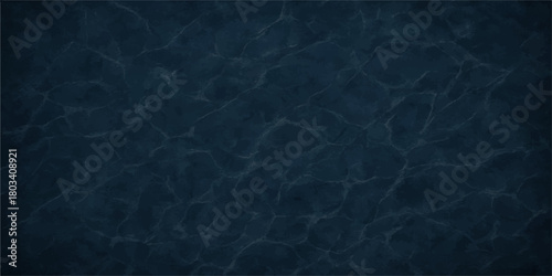Dark blue abstract background of clear ocean water surface pattern with light reflection