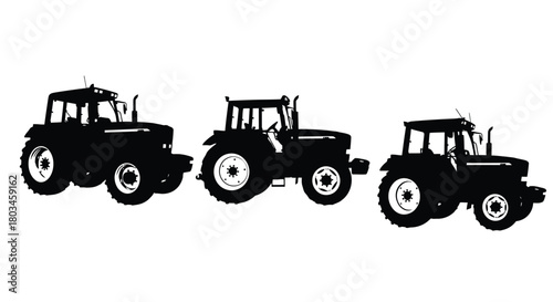 Three tractors in silhouette, farm equipment