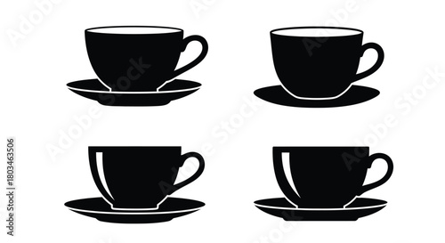 Four black teacups for hot beverage enjoyment