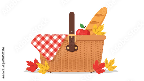 Woven picnic basket with red gingham cloth apple baguette and scattered red and yellow autumn leaves