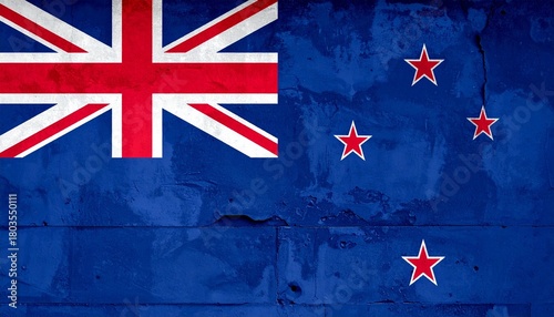 “New Zealand flag with blue field, Union Jack, and four red stars on cracked textured surface”