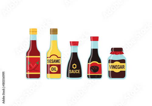 Five bottles of Asian cooking sauces and oils isolated on white background