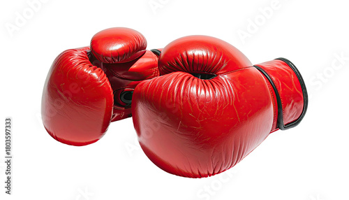 Two bright red boxing gloves rest against a black backdrop