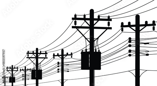 Silhouette of multiple electrical utility poles with transformers and overhead power lines creating complex energy distribution infrastructure across urban industrial environment