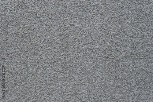 風化と経年劣化によるテクスチャ：不規則なデコボコな壁のクローズアップ