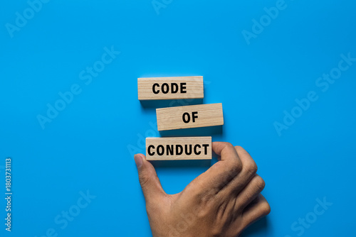Canvas Print code of conduct words on wooden blocks isolated on blue background