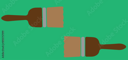 two brushes on a green background,