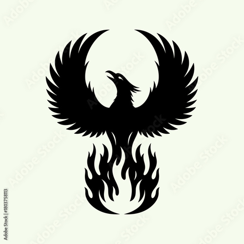 Majestic phoenix silhouette soaring from flames representing rebirth and power.