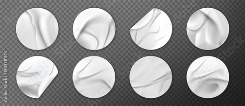 White creased sticker paper set with realistic wrinkled texture and curved edges. Round adhesive labels mockup collection on transparent background for branding or promotional material applications.